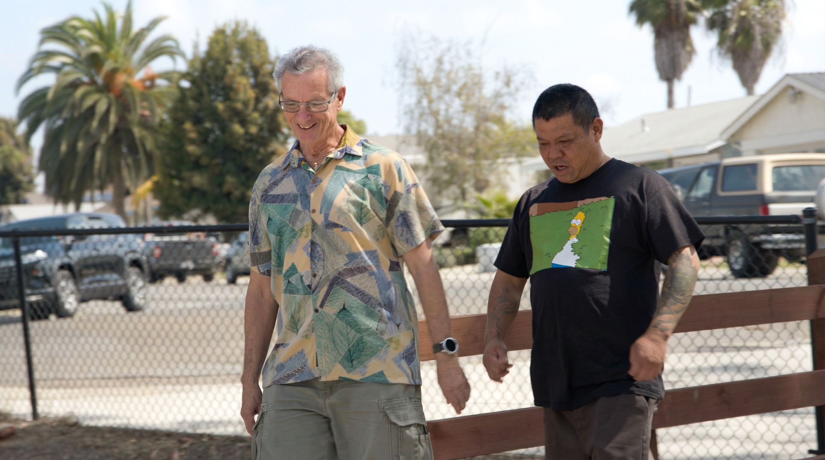 Ambassador Howard and his son walking 
